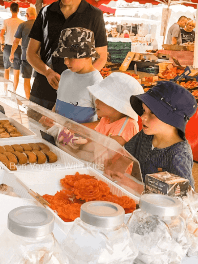 Kids looking at food at French Market.