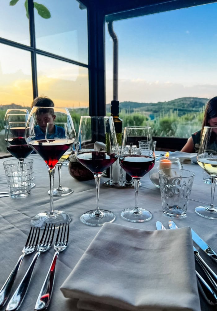 wine glasses on table in tuscany
